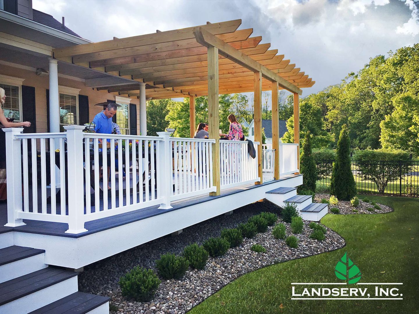 A newly installed back porch with people eating
